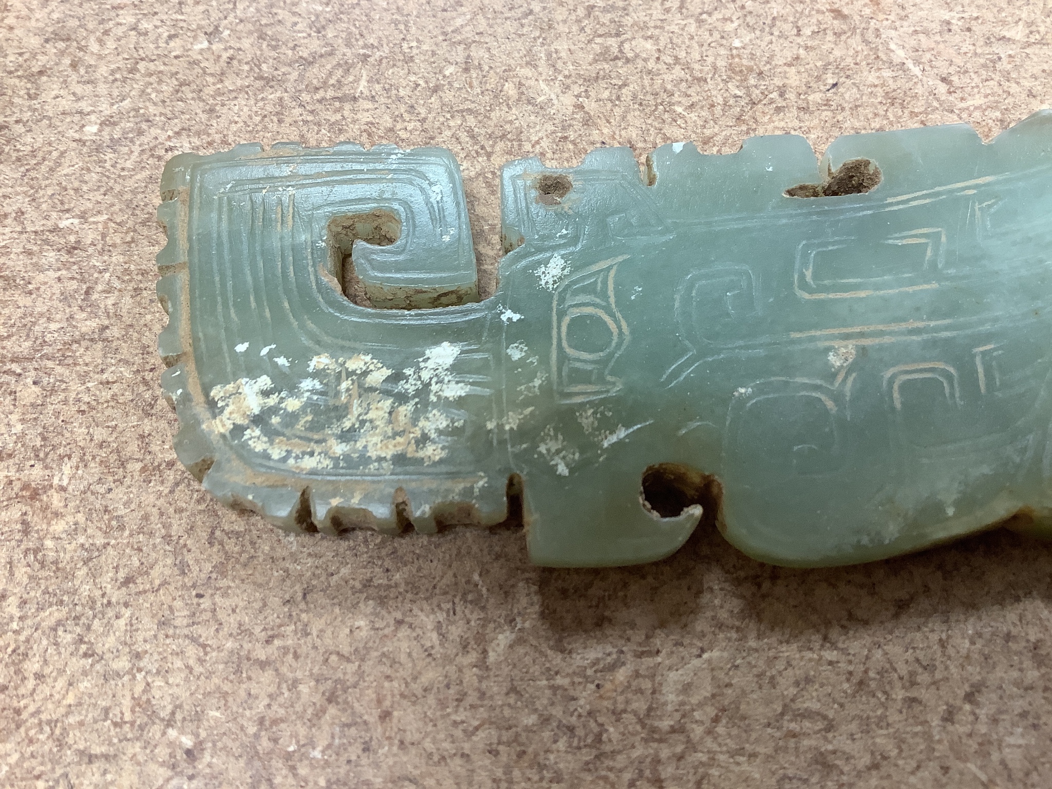 A Chinese archaistic green jade plaque, width 9cm